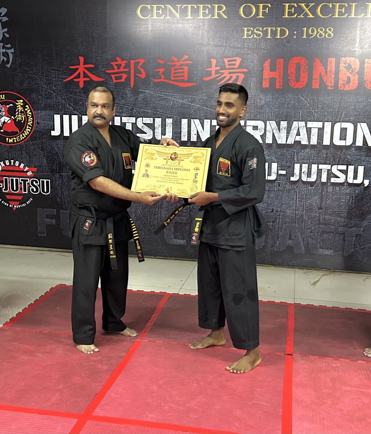 Silas Stanley Thomas receiving his Black Belt 1st Dan Shodan Yudansha diploma in Ju-Jutsu